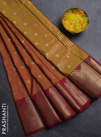 Semi raw silk saree dual shade of dark mustard and maroon with allover kalamkari prints & 1000 zari buttas and zari woven border