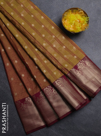 Semi raw silk saree dual shade of dark mustard green and wine shade with allover kalamkari prints & 1000 zari buttas and zari woven border