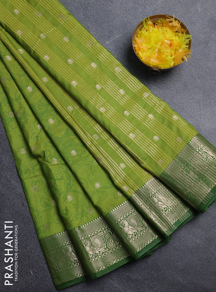 Semi raw silk saree light green with allover kalamkari prints & 1000 zari buttas and zari woven border