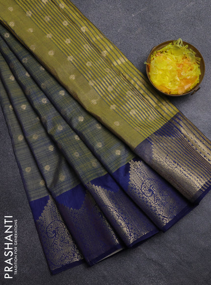 Semi raw silk saree sap green and blue with allover prints & 1000 buttas and zari woven border