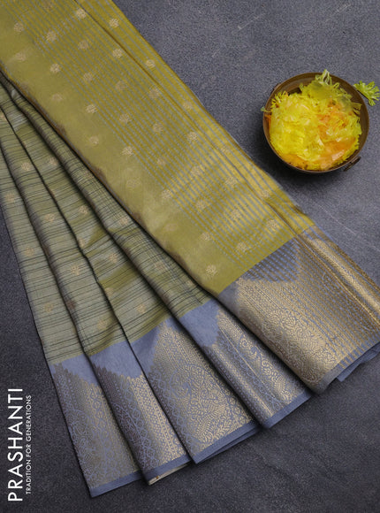 Semi raw silk saree green shade and grey with allover prints & 1000 buttas and zari woven border