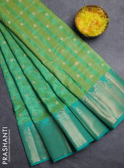 Semi raw silk saree teal green with floral prints & 1000 buttas and zari woven border