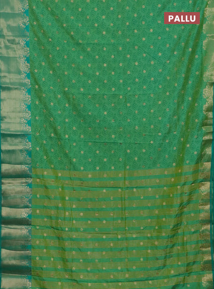 Semi raw silk saree teal green with floral prints & 1000 buttas and zari woven border