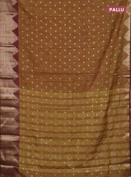 Semi raw silk saree mehendi green and brown with allover kalamkari prints & 1000 zari buttas and temple design zari woven border