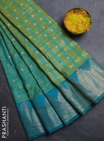 Semi raw silk saree dual shade of teal bluish green and teal green with allover kalamkari prints & 1000 zari buttas and temple design zari woven border