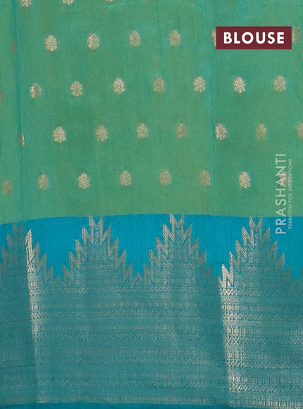 Semi raw silk saree dual shade of teal bluish green and teal green with allover kalamkari prints & 1000 zari buttas and temple design zari woven border
