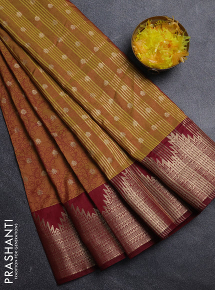 Semi raw silk saree dark mustard and deep maroon with allover kalamkari prints & 1000 zari buttas and temple design zari woven border
