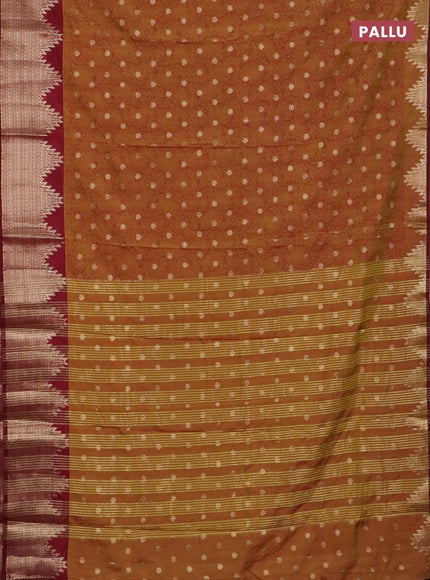 Semi raw silk saree dark mustard and deep maroon with allover kalamkari prints & 1000 zari buttas and temple design zari woven border