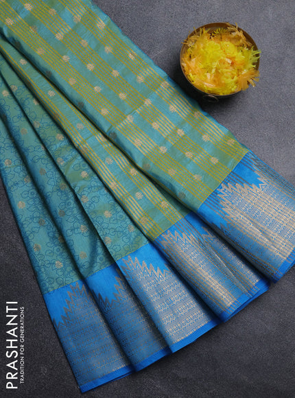 Semi raw silk saree dual shade of teal blue and cs blue with allover kalamkari prints & 1000 zari buttas and temple design zari woven border