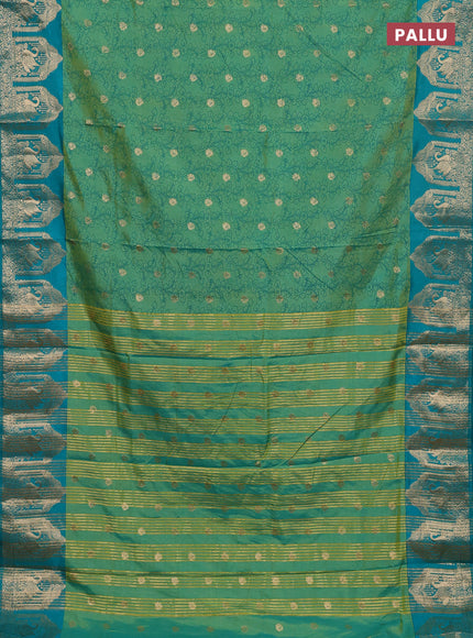 Semi raw silk saree dual shade of teal bluish green and teal green with allover kalamkari prints & 1000 zari buttas and zari woven butta border