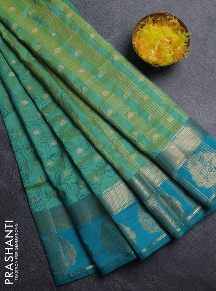 Semi raw silk saree dual shade of teal bluish green and teal green with allover kalamkari prints & 1000 zari buttas and zari woven butta border