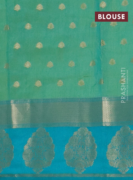 Semi raw silk saree dual shade of teal bluish green and teal green with allover kalamkari prints & 1000 zari buttas and zari woven butta border
