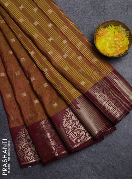 Semi raw silk saree dual shade of dark mustard green and wine shade with allover kalamkari prints & 1000 zari buttas and zari woven border