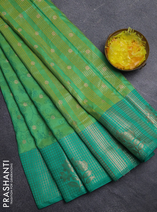 Semi raw silk saree light green and teal green with allover prints & 1000 buttas and zari checked butta border