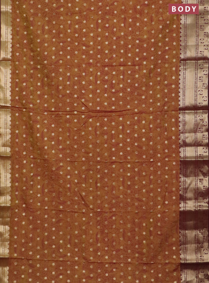 Semi raw silk saree dual shade of dark mustard green and wine shade with allover kalamkari prints & 1000 buttas and zari woven border