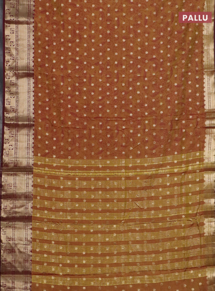 Semi raw silk saree dual shade of dark mustard green and wine shade with allover kalamkari prints & 1000 buttas and zari woven border