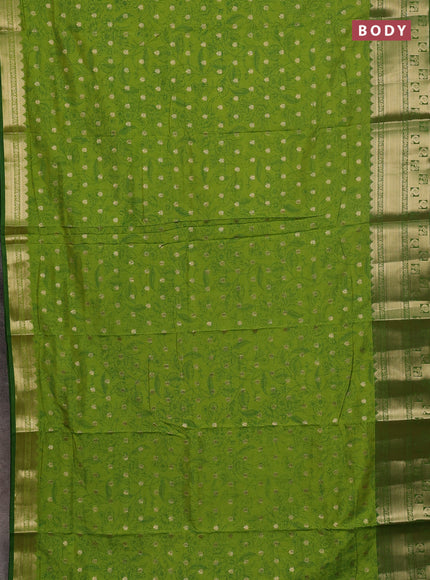 Semi raw silk saree light green and green with allover kalamkari prints & 1000 buttas and zari woven border