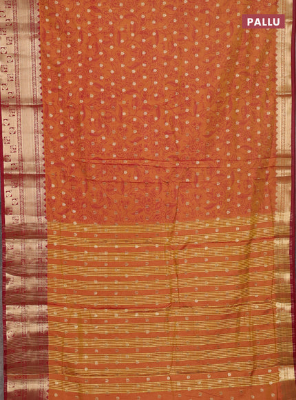 Semi raw silk saree dual shade of dark mustard and maroon with allover kalamkari prints & 1000 buttas and zari woven border
