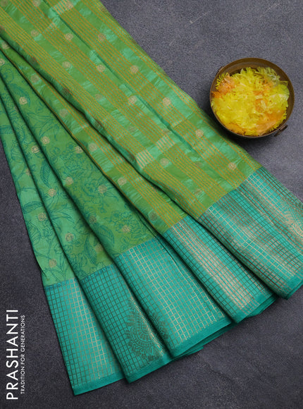 Semi raw silk saree dual shade of teal bluish green and teal green with allover prints & 1000 buttas and zari checked butta border