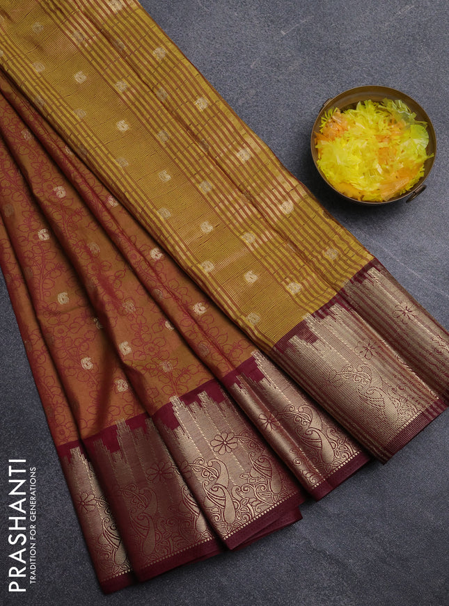 Semi raw silk saree dual shade of dark mustard and maroon with allover kalamkari prints & 1000 zari buttas and temple design zari woven border