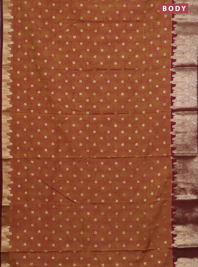 Semi raw silk saree dual shade of dark mustard and maroon with allover kalamkari prints & 1000 zari buttas and temple design zari woven border