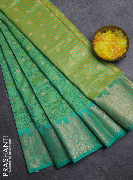 Semi raw silk saree dual shade of light gren and teal green with allover kalamkari prints & 1000 zari buttas and temple design zari woven border