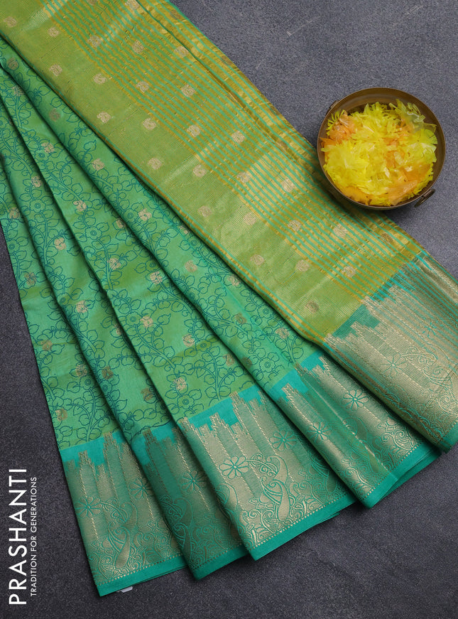 Semi raw silk saree dual shade of light gren and teal green with allover kalamkari prints & 1000 zari buttas and temple design zari woven border