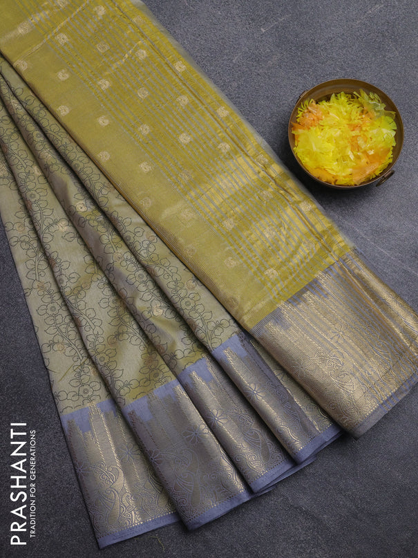 Semi raw silk saree elaichi green and grey with allover kalamkari prints & 1000 zari buttas and temple design zari woven border