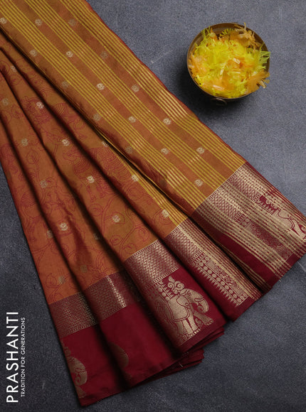 Semi raw silk saree dark mustard and maroon with allover kalamkari prints & 1000 zari buttas and zari woven elephant butta border