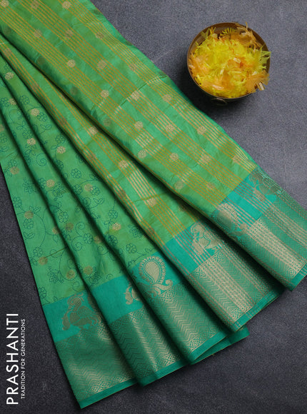 Semi raw silk saree dual shade of light green and teal green with allover prints & 1000 zari buttas and annam zari woven border