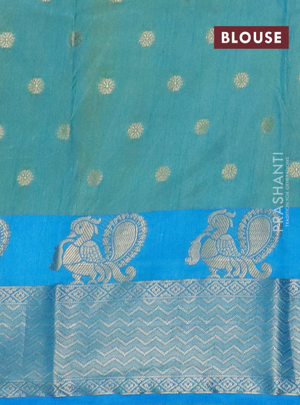 Semi raw silk saree dual shade of teal bluish green and cs blue with allover prints & 1000 zari buttas and annam zari woven border