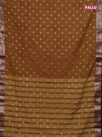 Semi raw silk saree dual shade of mustard green and wine shade with allover kalamkari prints & 1000 zari buttas and zari woven border