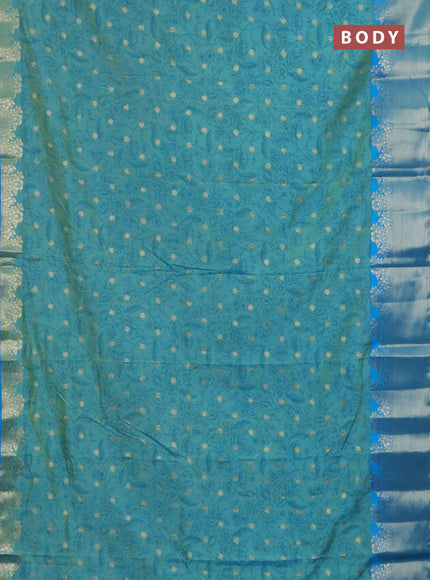 Semi raw silk saree dual shade of teal blue and cs blue with allover prints & 1000 zari buttas and zari woven border