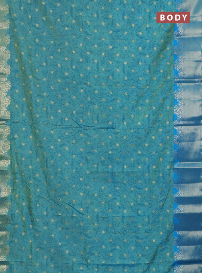 Semi raw silk saree dual shade of teal blue and cs blue with allover prints & 1000 zari buttas and zari woven border