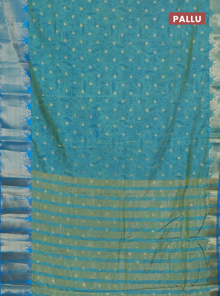 Semi raw silk saree dual shade of teal blue and cs blue with allover prints & 1000 zari buttas and zari woven border
