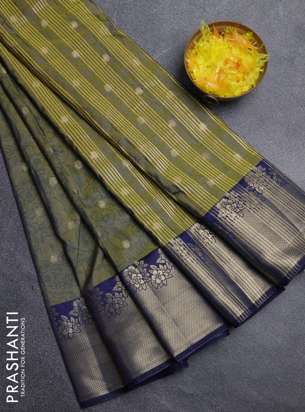 Semi raw silk saree dual shade of mehendi green and navy blue with allover prints & 1000 zari buttas and zari woven border