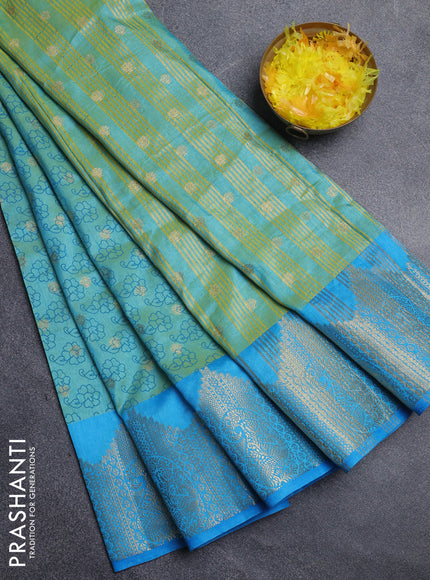 Semi raw silk saree dual shade of teal bluish green and cs blue with allover floral butta prints & 1000 zari buttas and zari woven border