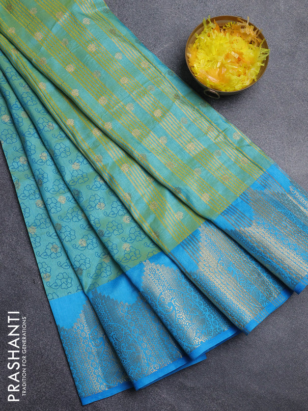 Semi raw silk saree dual shade of teal bluish green and cs blue with allover floral butta prints & 1000 zari buttas and zari woven border