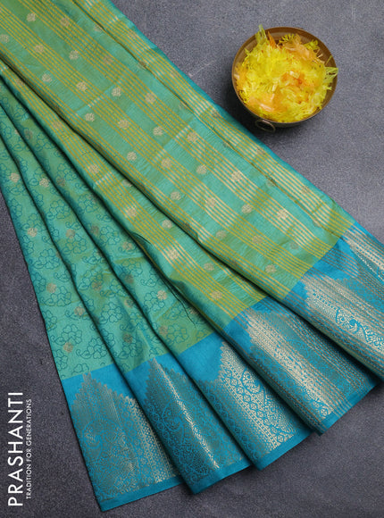 Semi raw silk saree dual shade of light greenish blue and teal blue with allover floral butta prints & 1000 zari buttas and zari woven border