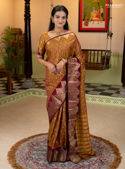 Semi raw silk saree dual shade of dark mustard and wine shade with allover floral butta prints & 1000 zari buttas and zari woven border