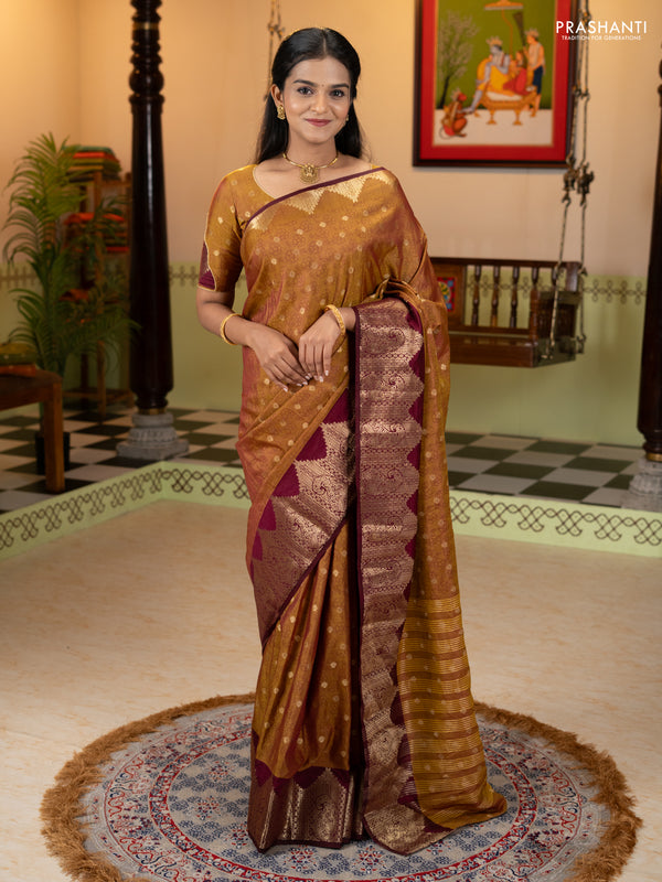 Semi raw silk saree dual shade of dark mustard and wine shade with allover floral butta prints & 1000 zari buttas and zari woven border