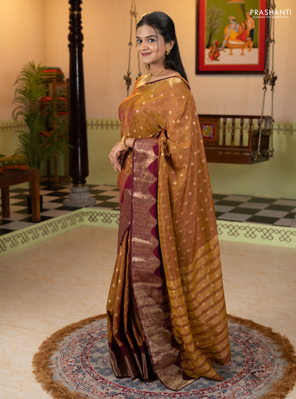 Semi raw silk saree dual shade of dark mustard and wine shade with allover floral butta prints & 1000 zari buttas and zari woven border