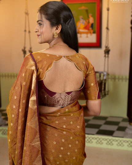 Semi raw silk saree dual shade of dark mustard and wine shade with allover floral butta prints & 1000 zari buttas and zari woven border