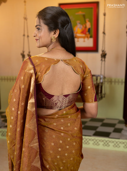 Semi raw silk saree dual shade of dark mustard and wine shade with allover floral butta prints & 1000 zari buttas and zari woven border