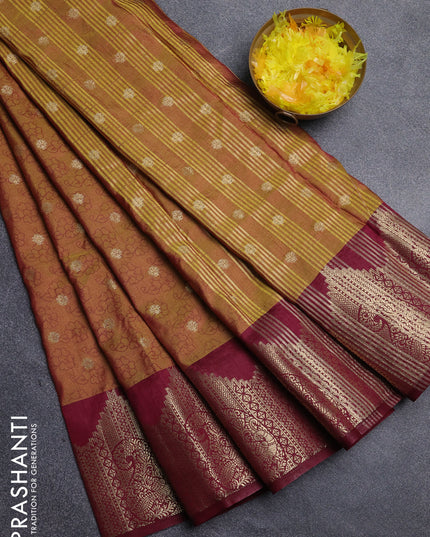 Semi raw silk saree dual shade of dark mustard and wine shade with allover floral butta prints & 1000 zari buttas and zari woven border