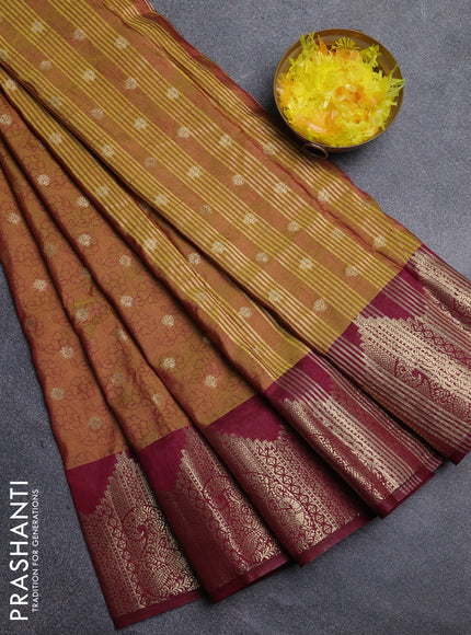 Semi raw silk saree dual shade of dark mustard and wine shade with allover floral butta prints & 1000 zari buttas and zari woven border