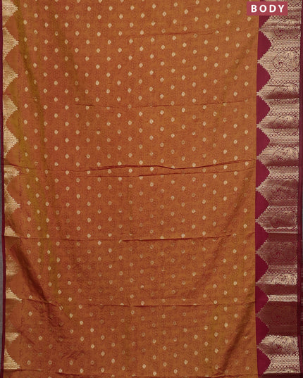 Semi raw silk saree dual shade of dark mustard and wine shade with allover floral butta prints & 1000 zari buttas and zari woven border