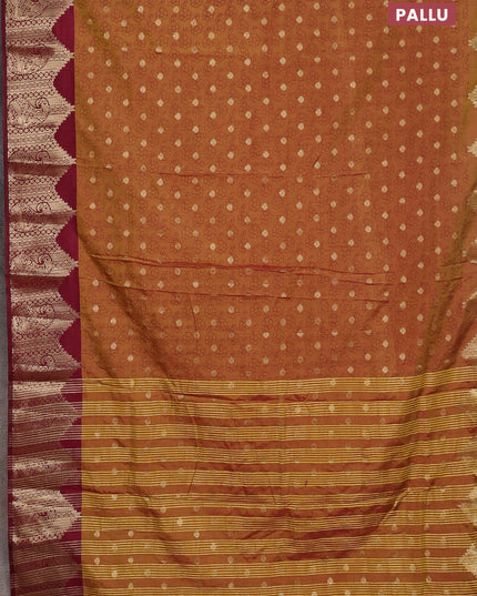 Semi raw silk saree dual shade of dark mustard and wine shade with allover floral butta prints & 1000 zari buttas and zari woven border
