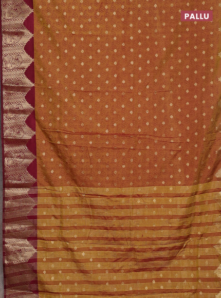 Semi raw silk saree dual shade of dark mustard and wine shade with allover floral butta prints & 1000 zari buttas and zari woven border