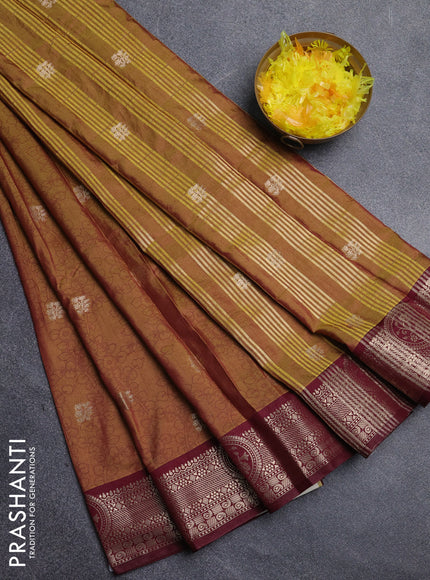 Semi raw silk saree dual shade of mustard green and wine shade with allover kalamkari prints & 1000 zari buttas and zari woven border